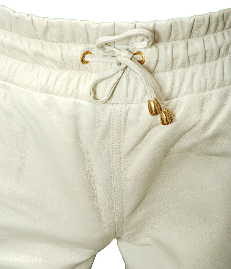 Picture of white leather jogggers, close up view of the wide elastic waist.