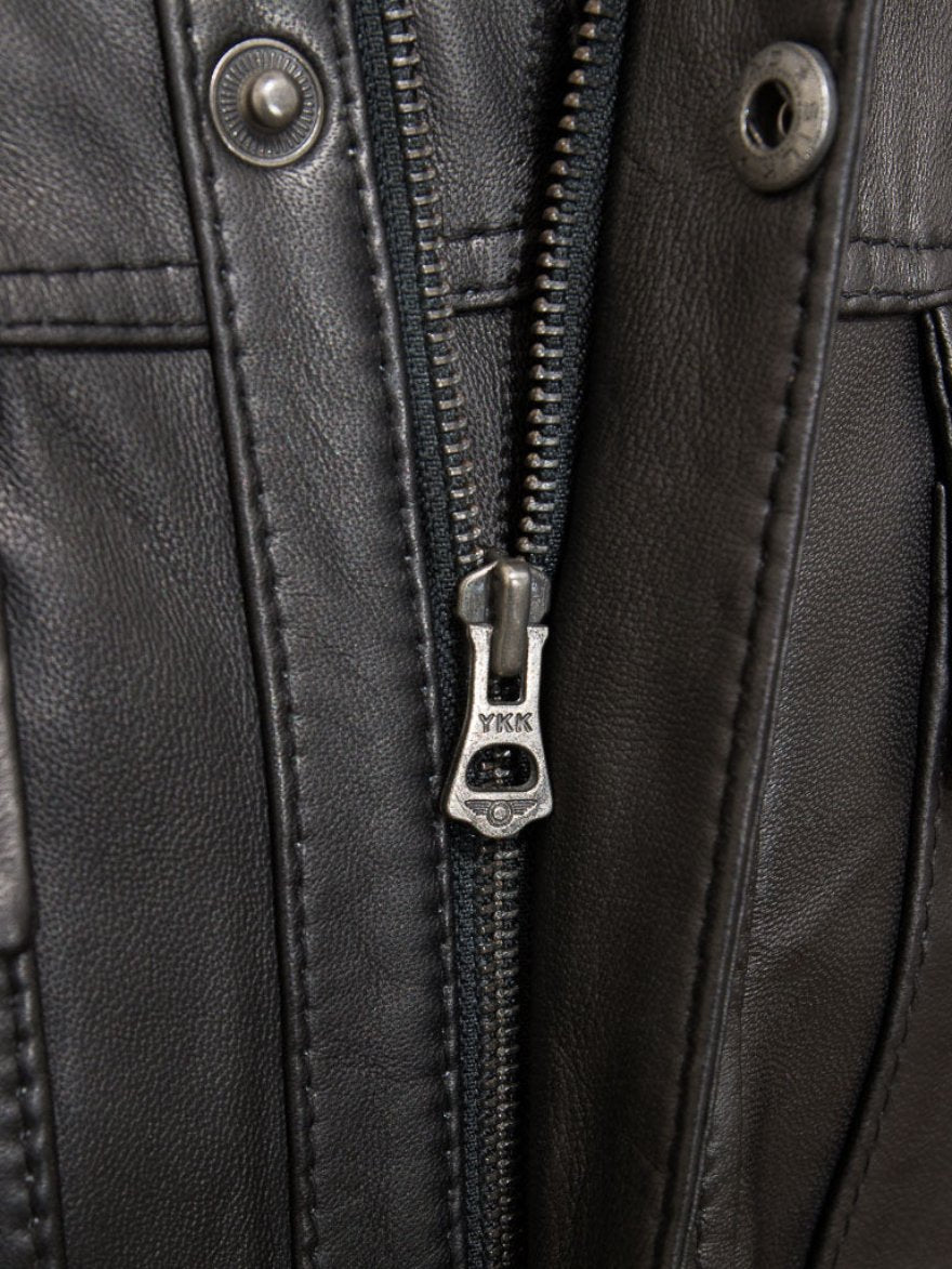 Picture of our Black Leather Field Jacket, close up view on the front zipper pull.