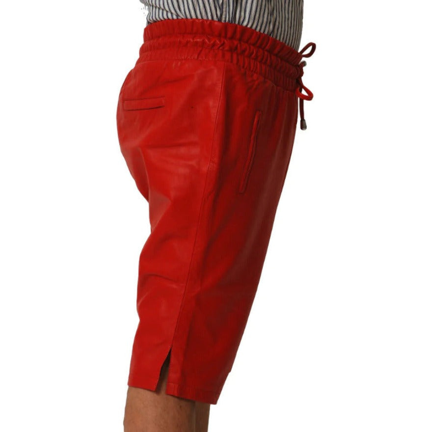 Picture of a model wearing our Mens Red leather shorts, side view