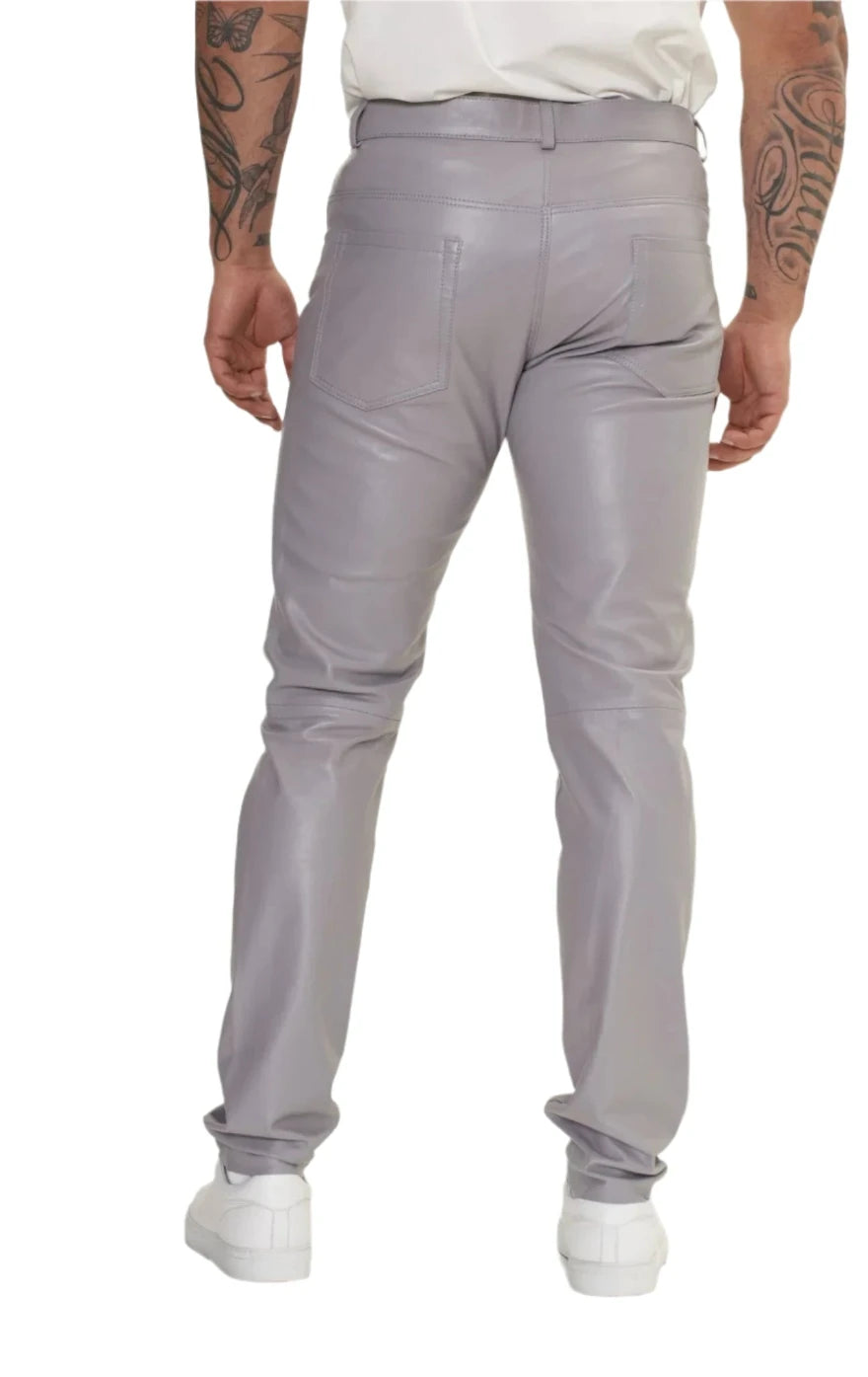 Picture of a model wearing our light grey leather pants. back view