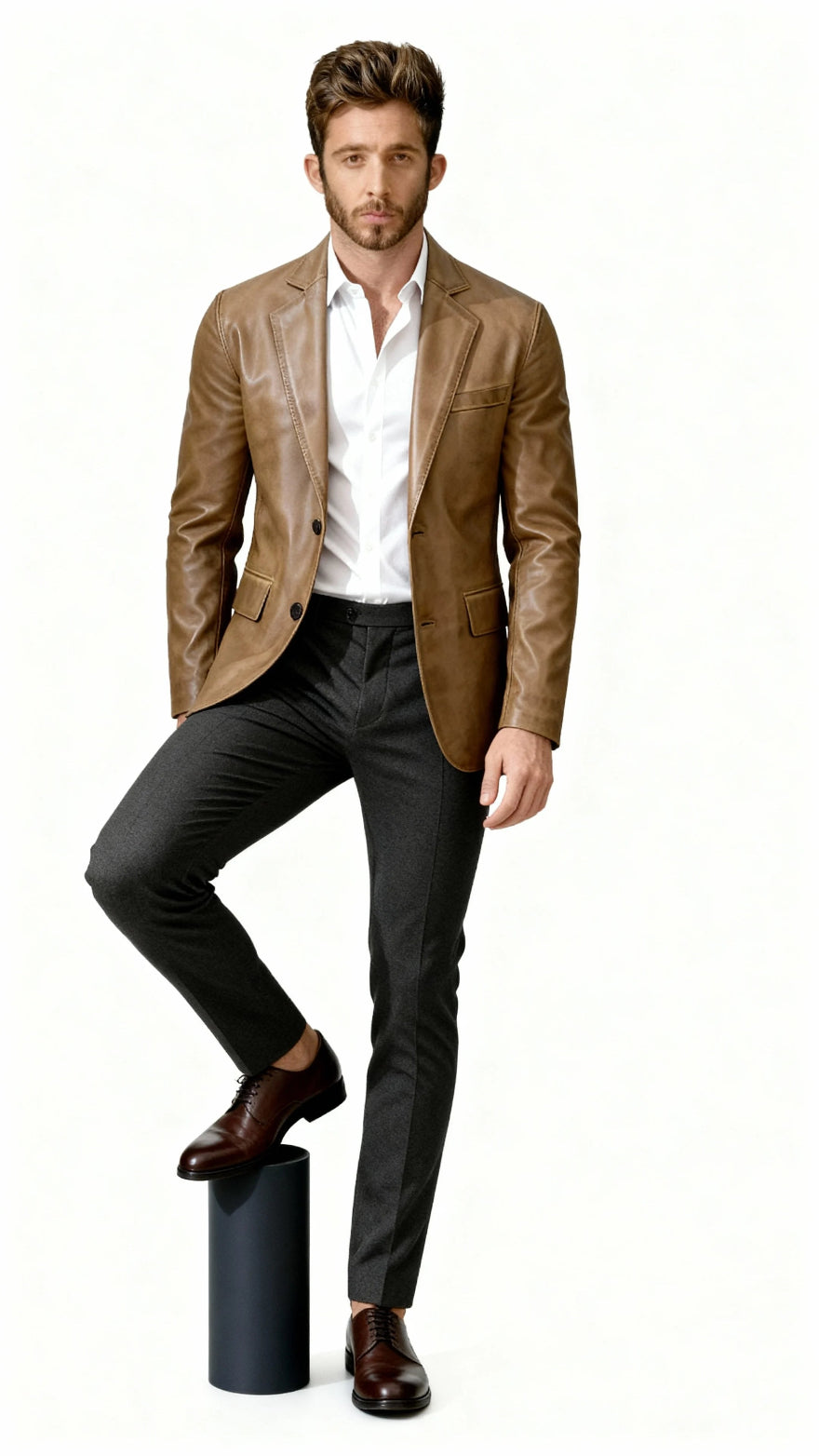 Man wearing a camel brown leather blazer, white shirt, and black pants on a white background