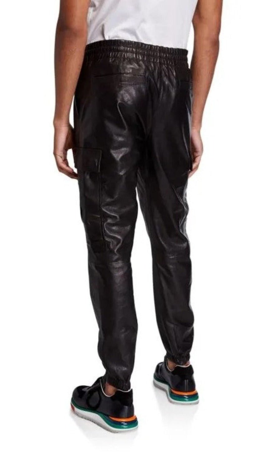 Picture of a model wearing our Black Leather Cargo Pants, back view.