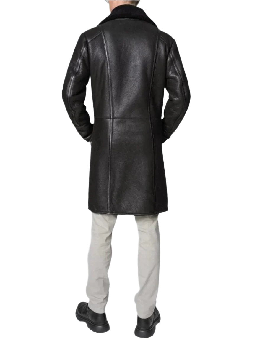 Picture of our Mens Leather Shearling Trench Coat in black on a model, back view.