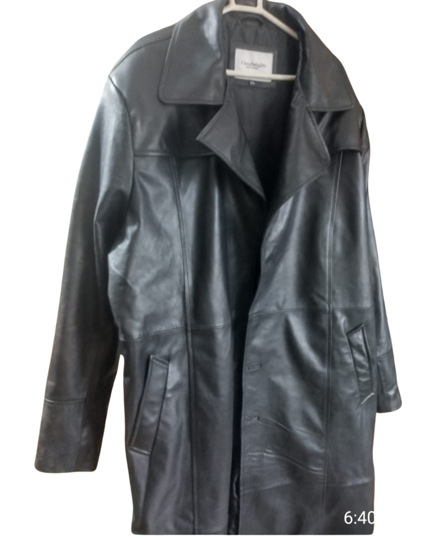 Picture of our Mens Leather Trench Coat Full Length in Black , front view. Image is on a hanger taken at our factory after production.