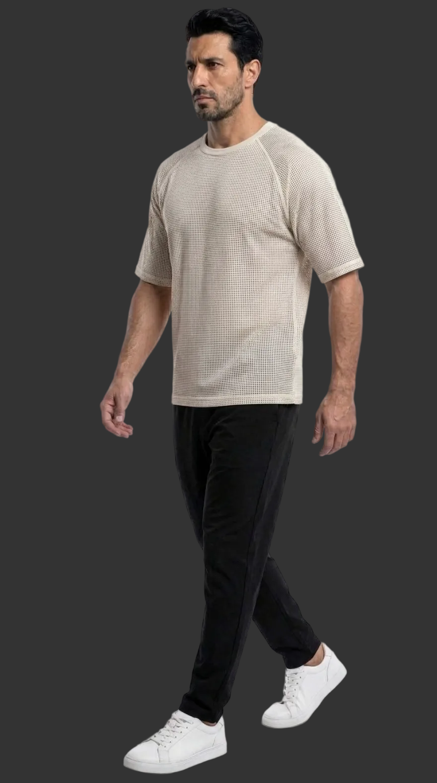 Picture of a model wearing our Mens White Perforated Leather Tee Shirt, Side view in a walking pose.