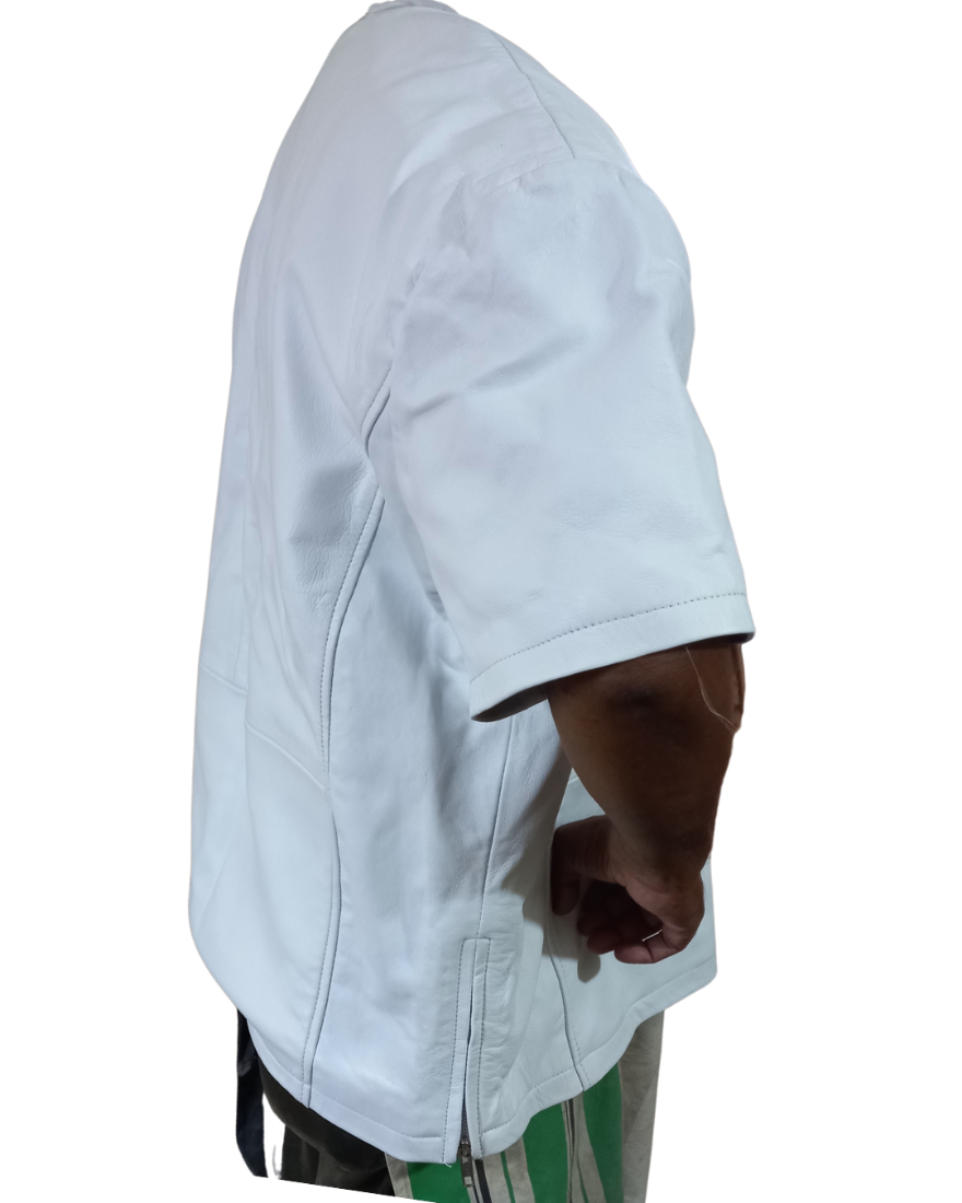A man wearing a white leather t-shirt with a classic tunic neck design and a central slit, featuring short sleeves and side zippers. side view.
