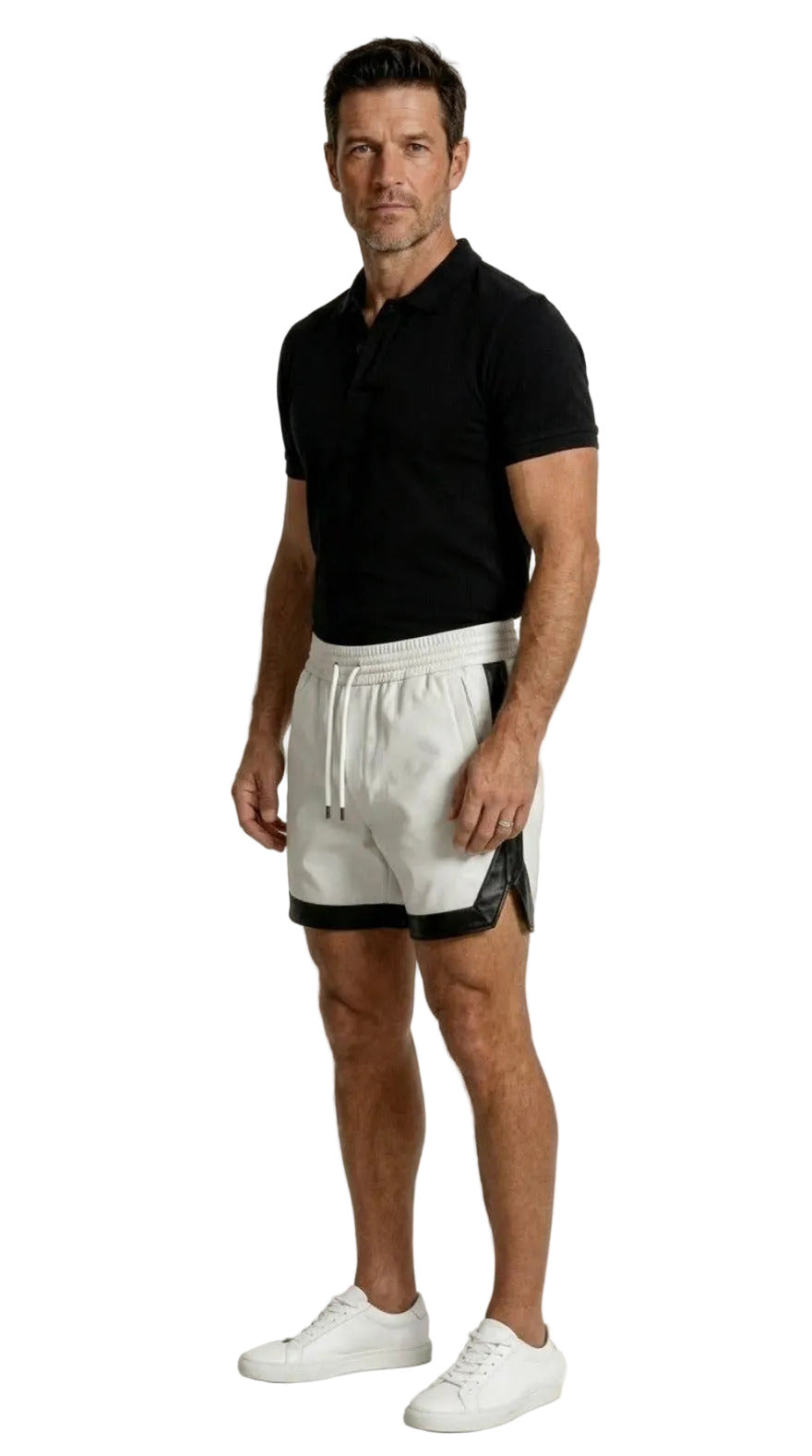 Man wearing a black cotton polo shirt and our mens white leather shorts with black side trim on a white background, side view.