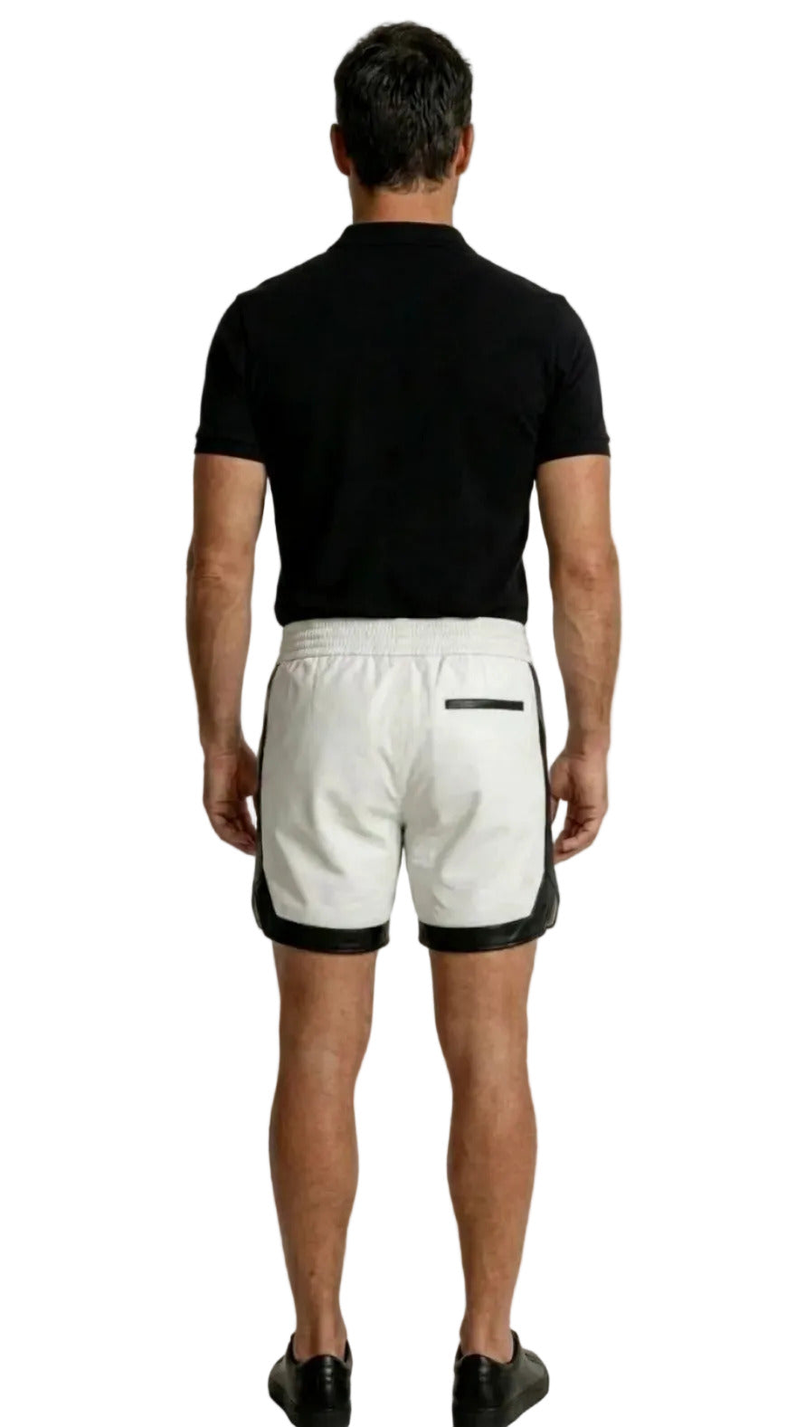 Man wearing a black cotton polo shirt and our white leather shorts with black trim on a white background, back view.