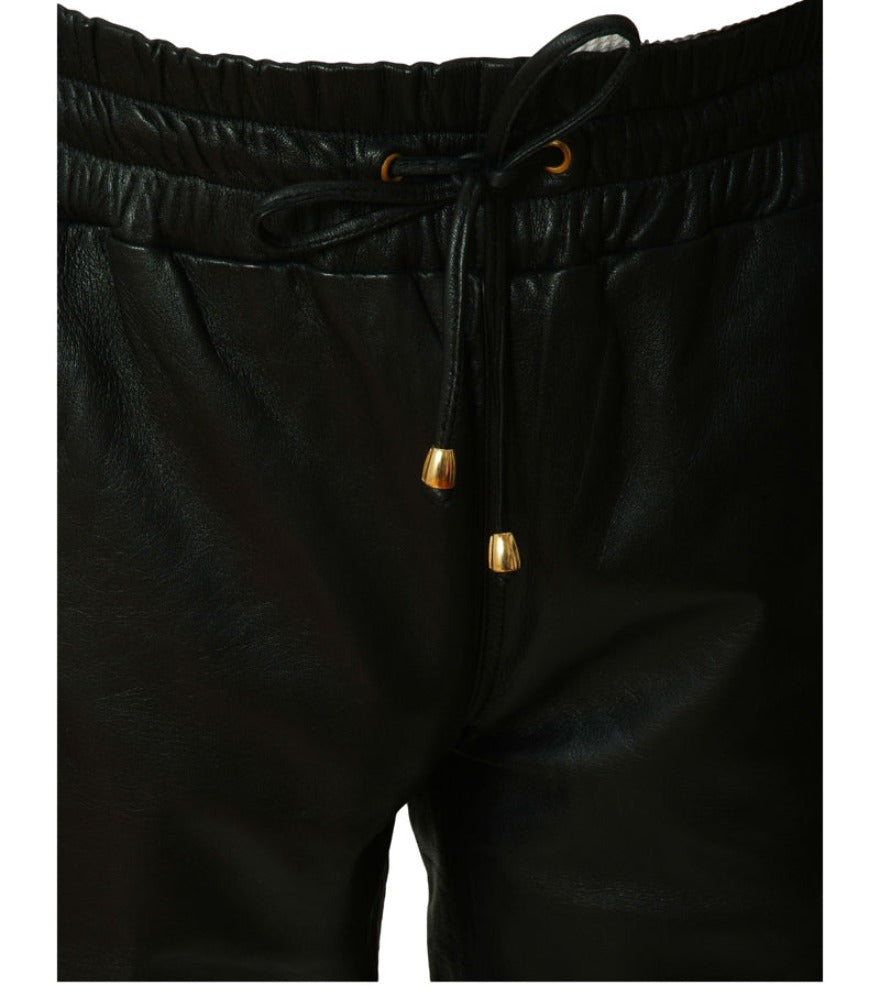 Picture of our mens black leather joggers,. Close up view of the elastic waist.