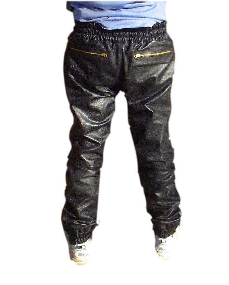 Picture of a model wearing our Black Snakeskin Pants Mens with 3 knee zippers, back view.